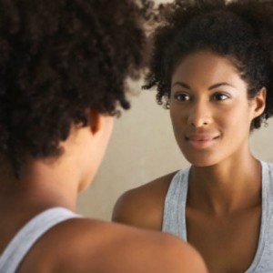 blk-woman-looking-in-mirror